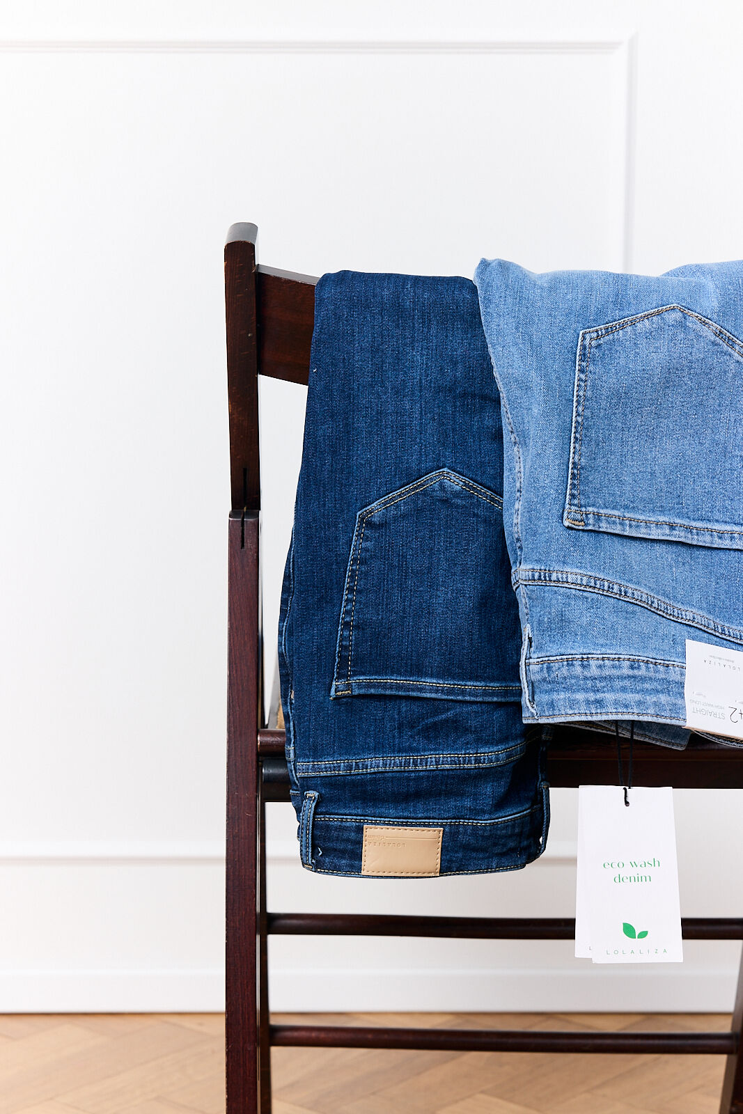 Jeans hanging over a chair